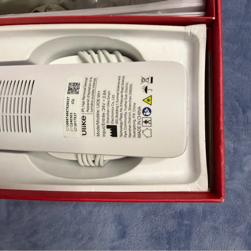 Ulike hair removal White Handheld Device in Original Box used 1 time‎